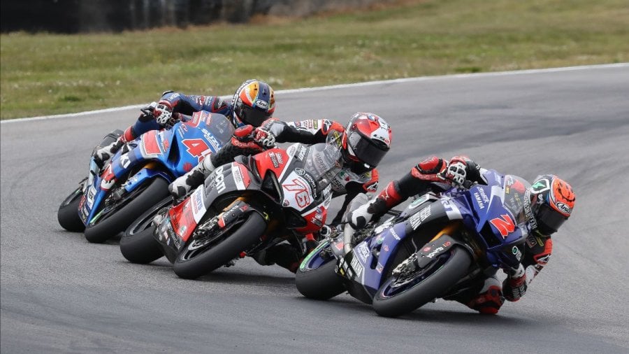 The best race in the HONOS Superbike race was the one for third between Josh Herrin (2), Loris Baz (76) and Cameron Petersen (45). Photo by Brian J. Nelson