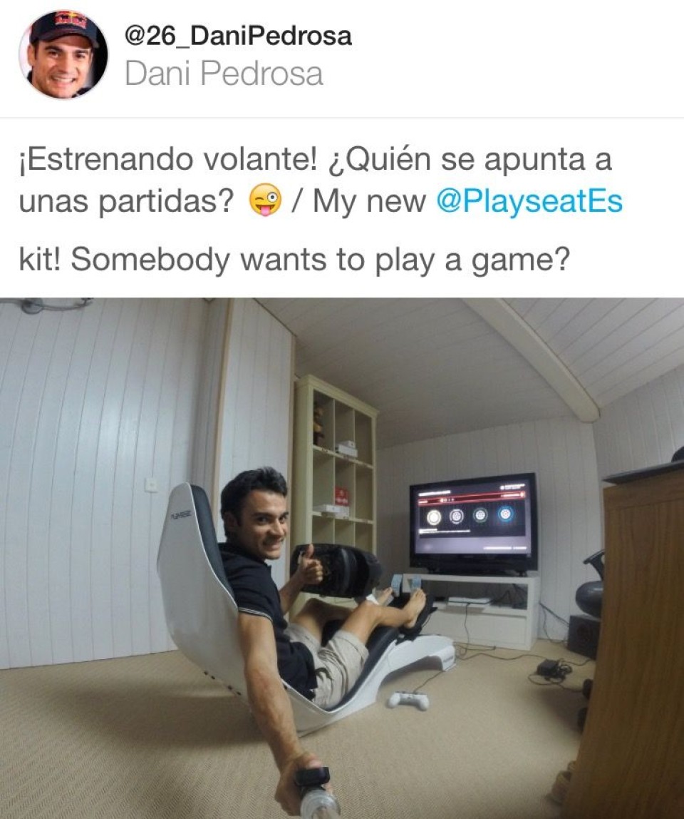 Dani Pedrosa relaxes by playing with the Playstation