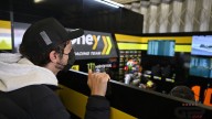MotoGP: LE FOTO - Valentino Rossi 'sbircia' nel suo box e fa da spalla a Marini
