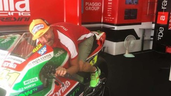 MotoGP: Max Biaggi climbs on the Aprilia MotoGP at Sepang